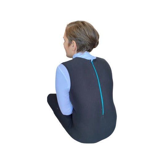 happy firl wearing a turtleneck under one of our special needs full length zip back bodysuits