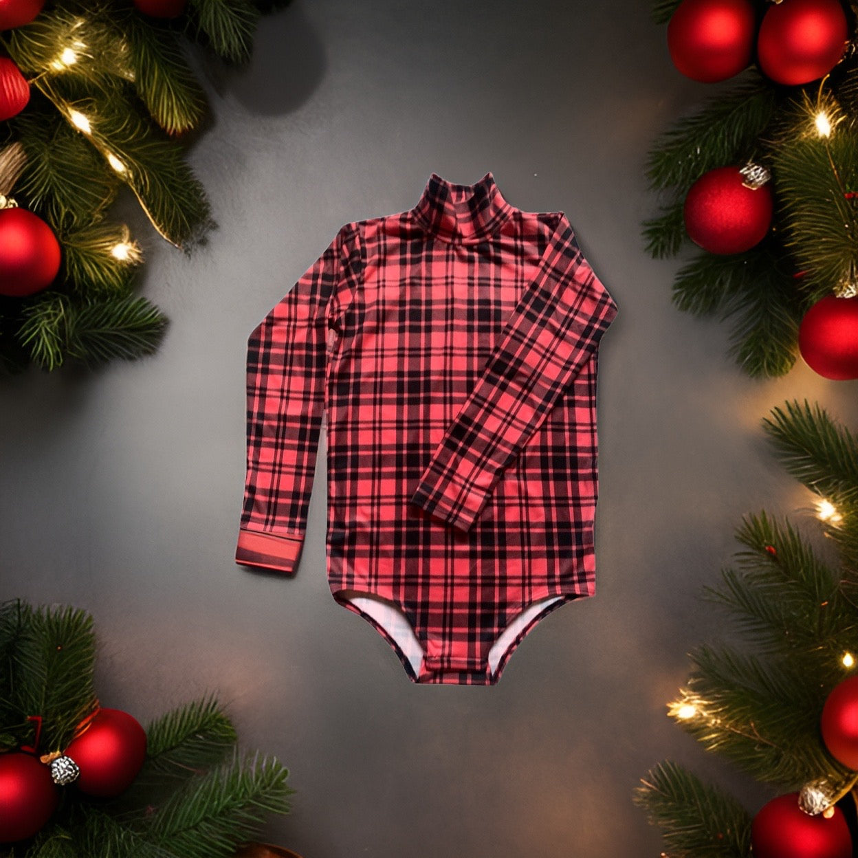 A festive plaid shirt in red and black, resting on a table adorned with Christmas decorations.