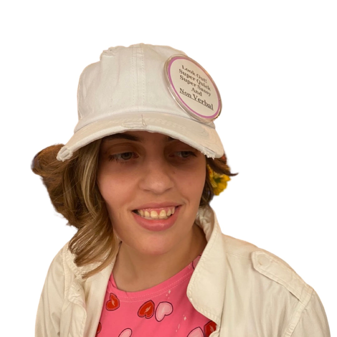 A woman wearing a heart-decorated hat promoting Special Needs Awareness Buttons Custom Non Verbal