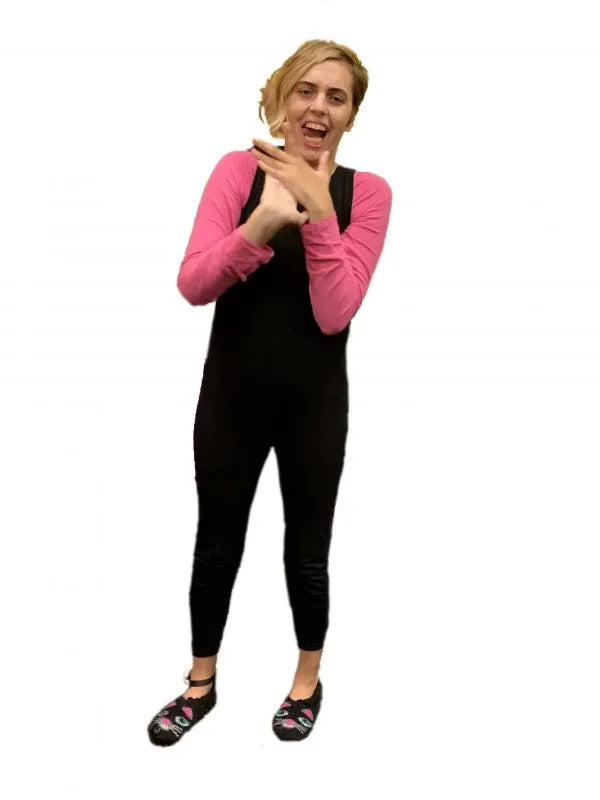 A woman wearing a pink shirt and black pants, showcasing Special Needs Bodysuits