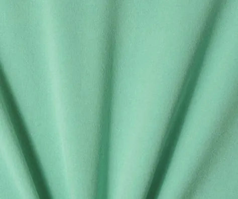 A  vibrant green fabric, showcasing its texture and color for Girls and Womens Onesies Stylish Colors and Sleeves