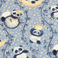 Panda bears sitting under a crescent moon on a blue fabric